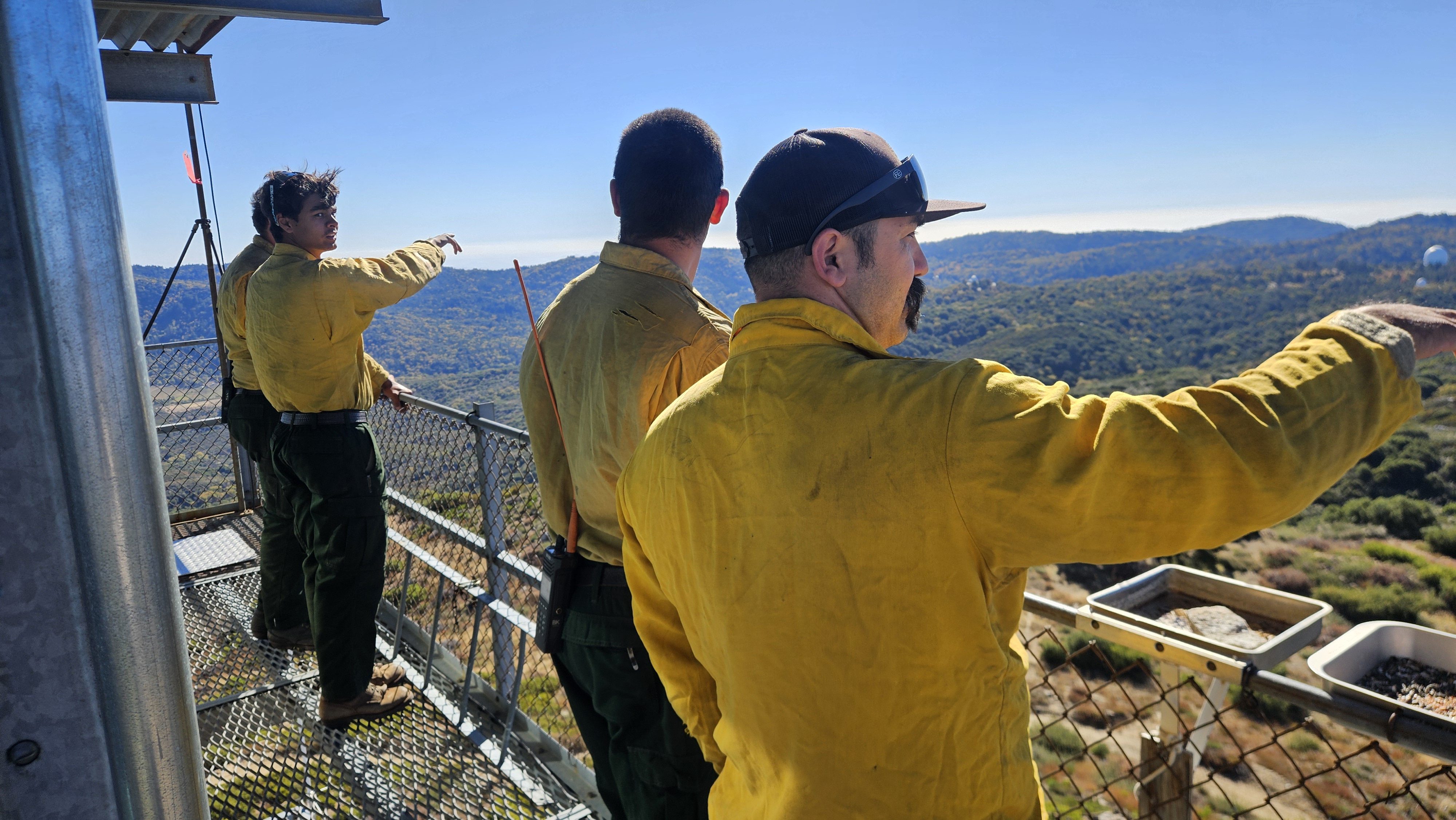 USFS crew on the High Point catwalk looking out over the district they work