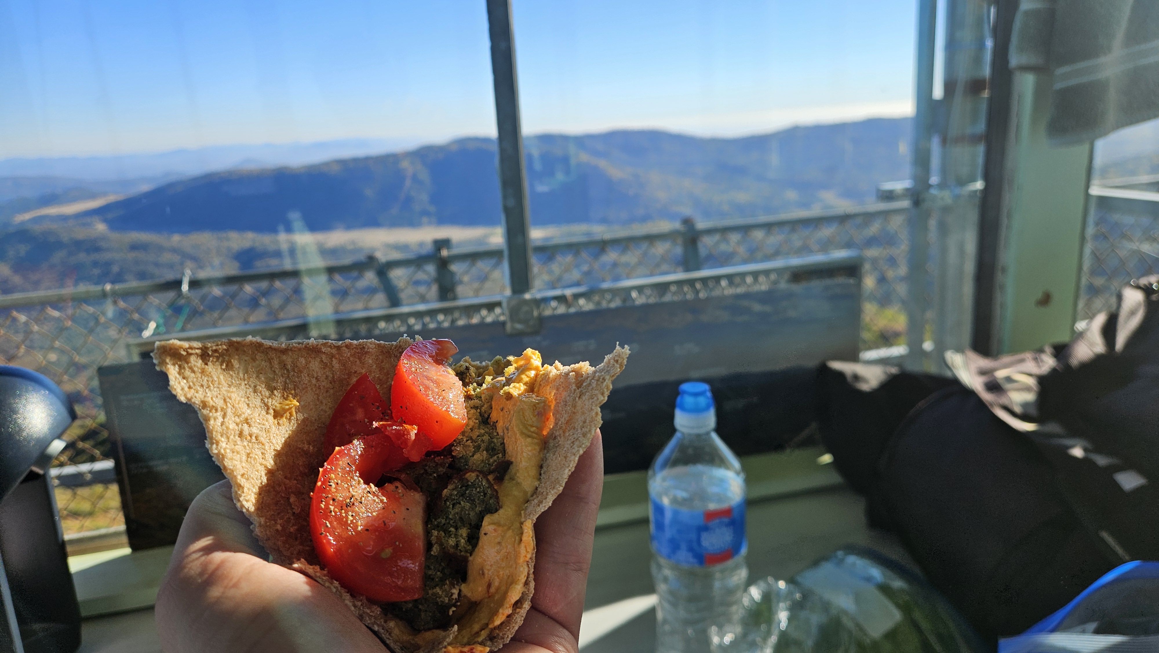Dinner on the catwalk with the eastern back-country and far ridges in low gold light
