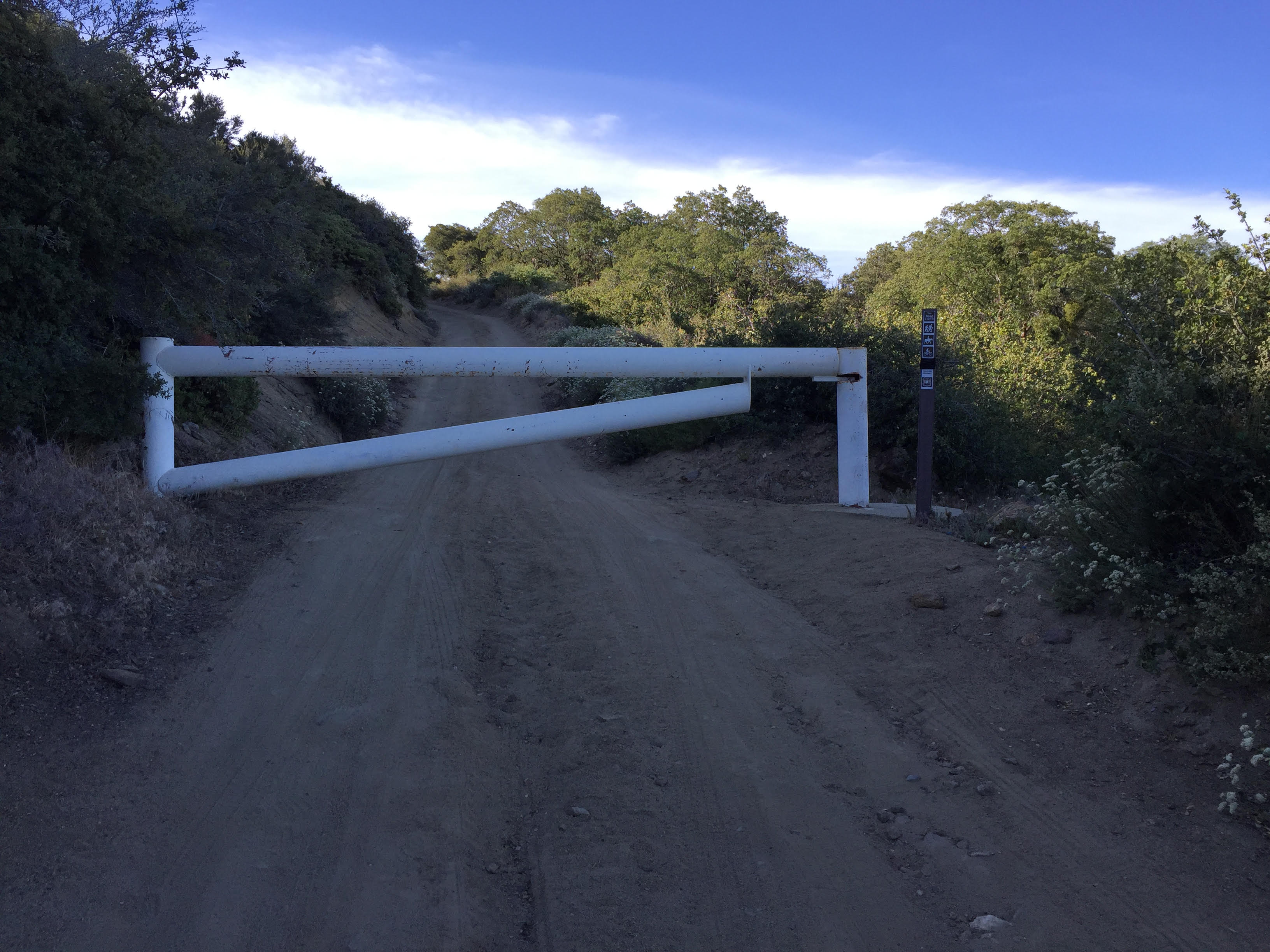 A heavy steel access gate on a steep switchback just below the High Point tower